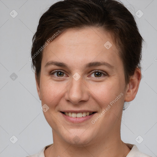 Joyful white young-adult female with short  brown hair and brown eyes