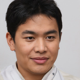 Joyful asian young-adult male with short  brown hair and brown eyes