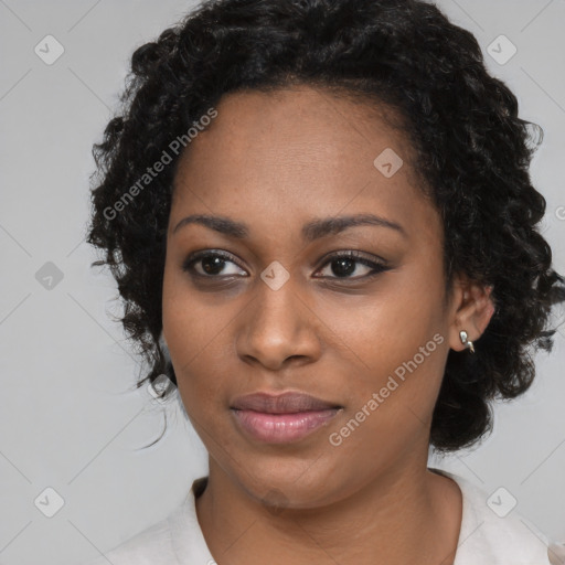 Joyful black young-adult female with medium  black hair and brown eyes