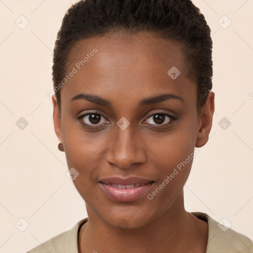 Joyful black young-adult female with short  brown hair and brown eyes