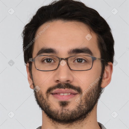 Joyful white young-adult male with short  black hair and brown eyes