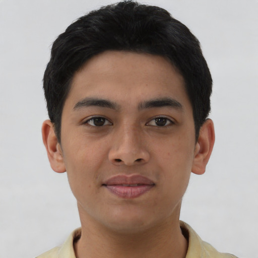 Joyful asian young-adult male with short  black hair and brown eyes