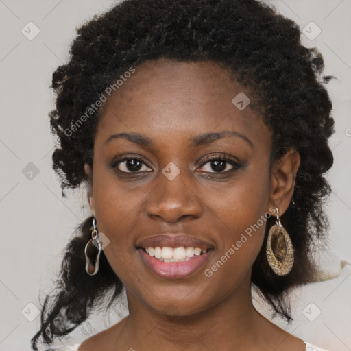 Joyful black young-adult female with medium  brown hair and brown eyes