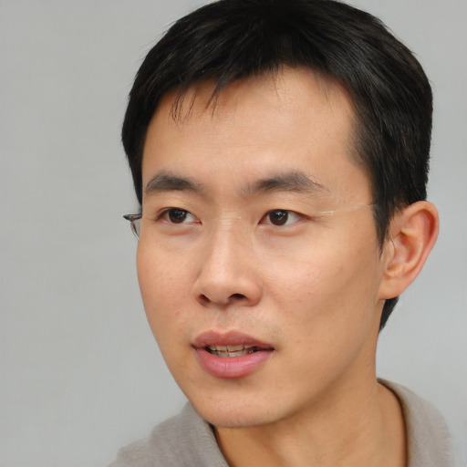 Neutral asian young-adult male with short  black hair and brown eyes