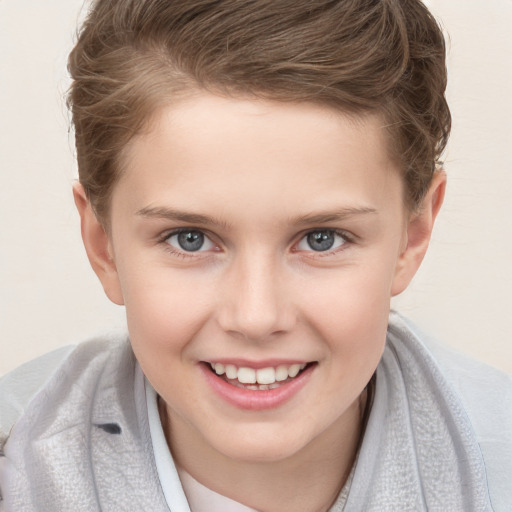 Joyful white child female with short  brown hair and grey eyes