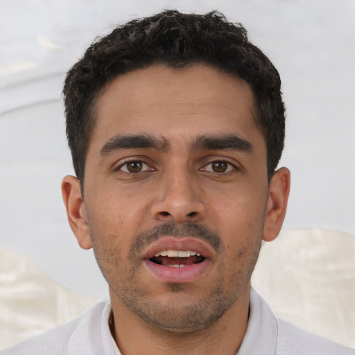 Neutral white young-adult male with short  black hair and brown eyes