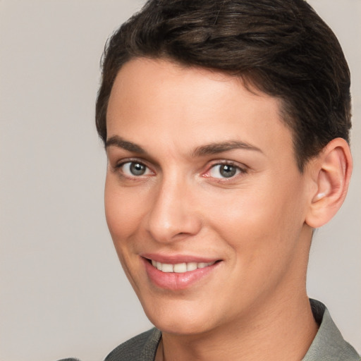 Joyful white young-adult female with short  brown hair and brown eyes