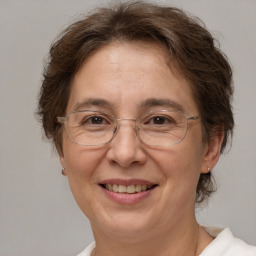 Joyful white middle-aged female with medium  brown hair and brown eyes