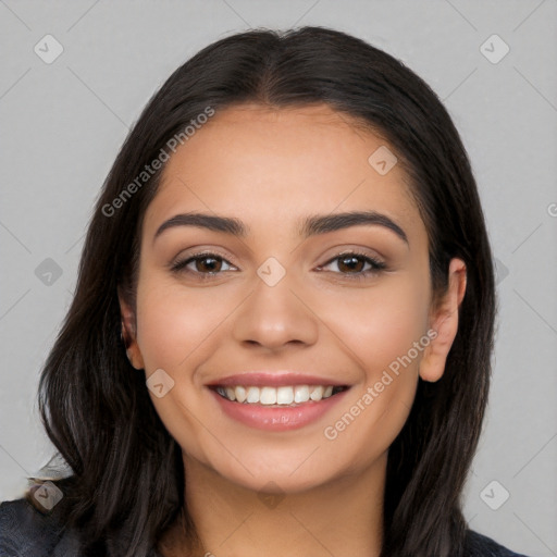 Joyful white young-adult female with long  black hair and brown eyes