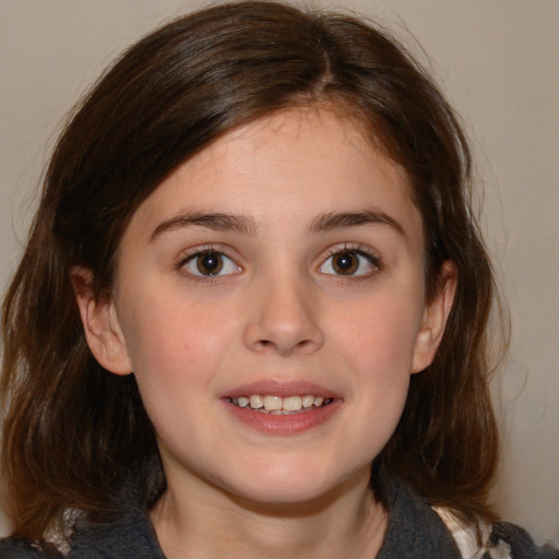 Joyful white child female with medium  brown hair and brown eyes