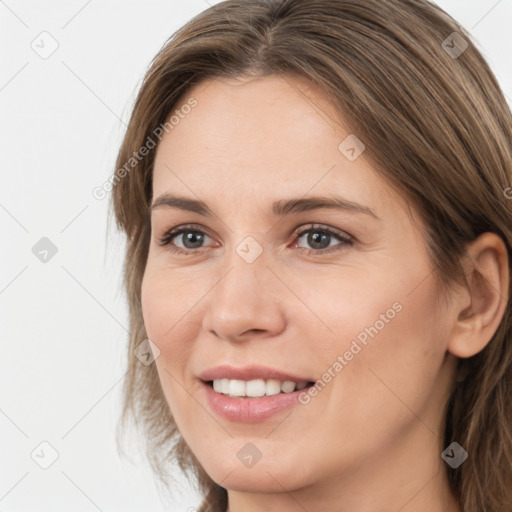 Joyful white young-adult female with medium  brown hair and brown eyes