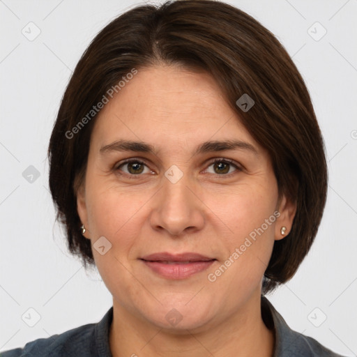 Joyful white adult female with medium  brown hair and grey eyes