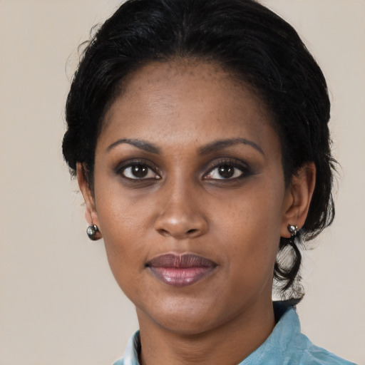 Neutral black young-adult female with medium  black hair and brown eyes