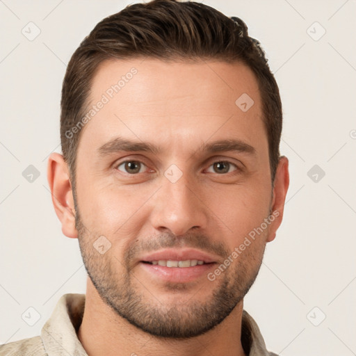 Joyful white young-adult male with short  brown hair and brown eyes