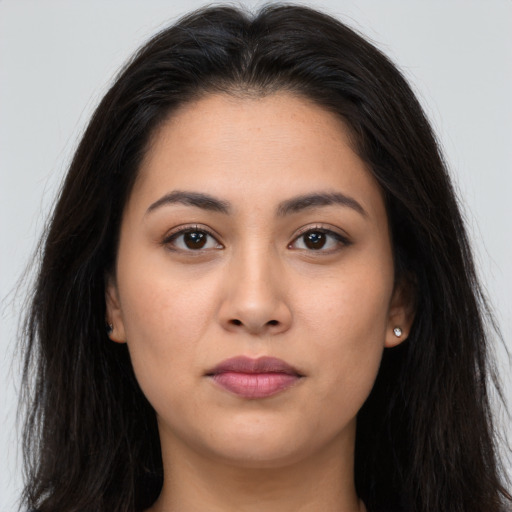 Neutral latino young-adult female with long  brown hair and brown eyes