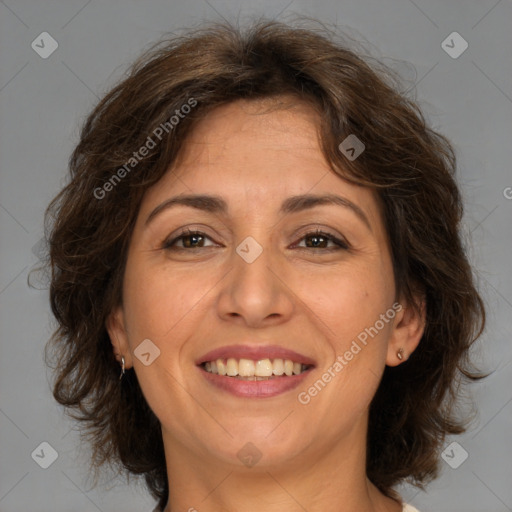 Joyful white adult female with medium  brown hair and brown eyes