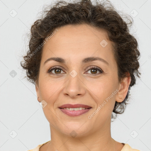 Joyful white adult female with short  brown hair and brown eyes