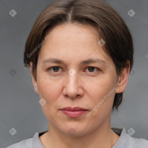 Joyful white adult female with short  brown hair and brown eyes