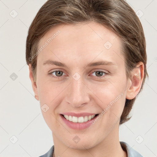 Joyful white young-adult female with short  brown hair and grey eyes