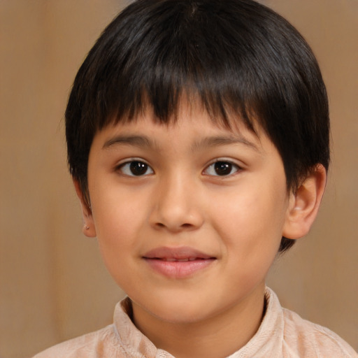 Joyful white child male with short  brown hair and brown eyes