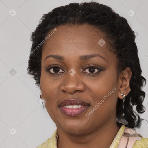 Joyful black young-adult female with medium  black hair and brown eyes