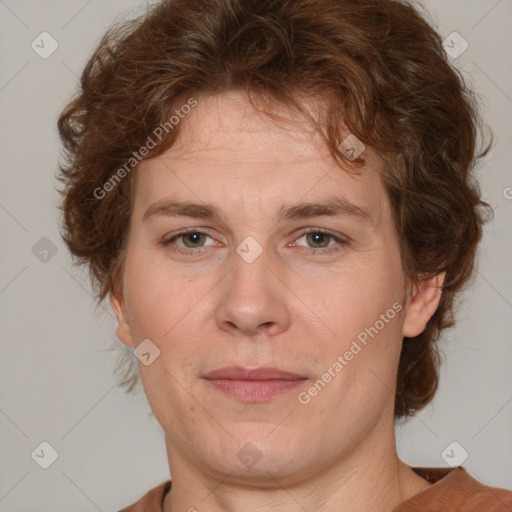 Joyful white adult male with medium  brown hair and brown eyes