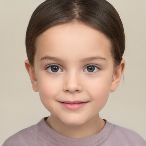 Joyful white child female with short  brown hair and brown eyes