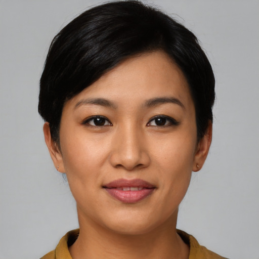 Joyful asian young-adult female with short  black hair and brown eyes