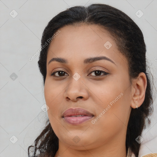 Joyful black young-adult female with medium  brown hair and brown eyes