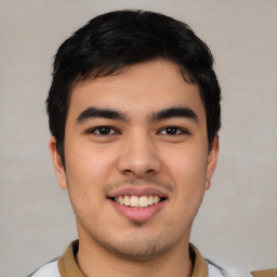 Joyful latino young-adult male with short  brown hair and brown eyes