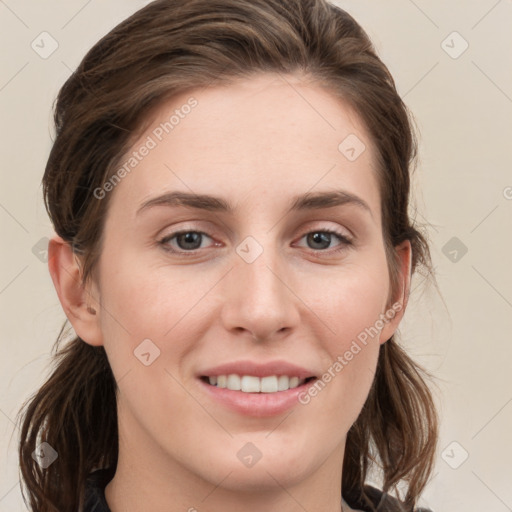 Joyful white young-adult female with medium  brown hair and grey eyes