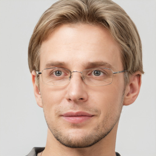 Joyful white adult male with short  brown hair and grey eyes