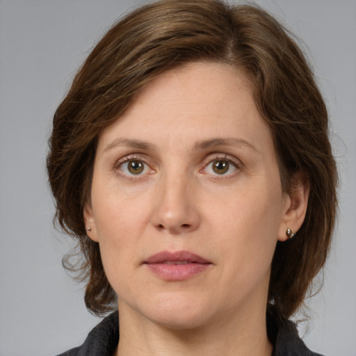 Neutral white adult female with medium  brown hair and green eyes