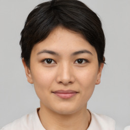 Joyful asian young-adult female with short  brown hair and brown eyes