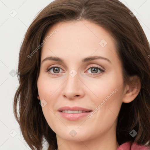 Joyful white young-adult female with long  brown hair and green eyes