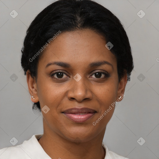 Joyful black young-adult female with short  black hair and brown eyes