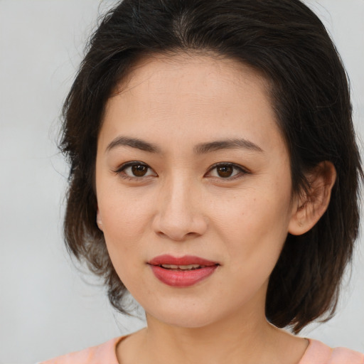 Joyful white young-adult female with medium  brown hair and brown eyes