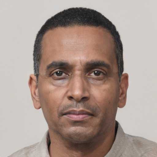 Neutral black adult male with short  black hair and brown eyes