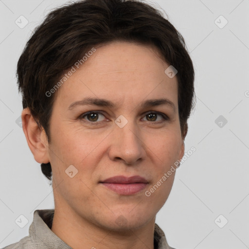 Joyful white adult female with short  brown hair and grey eyes