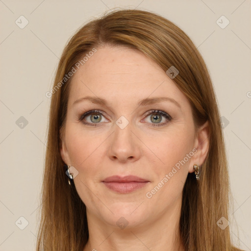 Joyful white adult female with long  brown hair and green eyes