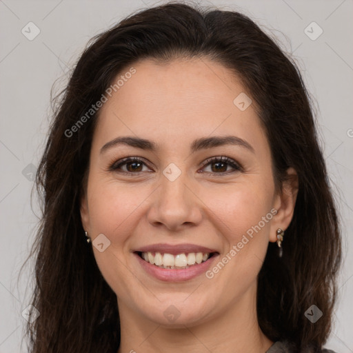 Joyful white young-adult female with long  brown hair and brown eyes