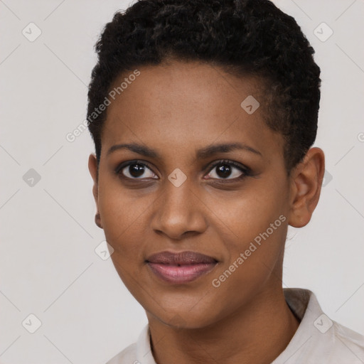 Joyful black young-adult female with short  black hair and brown eyes