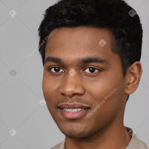 Joyful black young-adult male with short  black hair and brown eyes