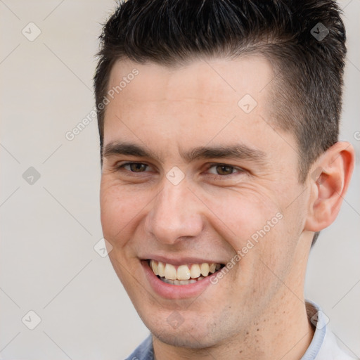 Joyful white adult male with short  brown hair and brown eyes