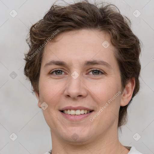 Joyful white adult female with short  brown hair and grey eyes