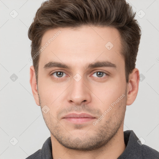 Neutral white young-adult male with short  brown hair and brown eyes