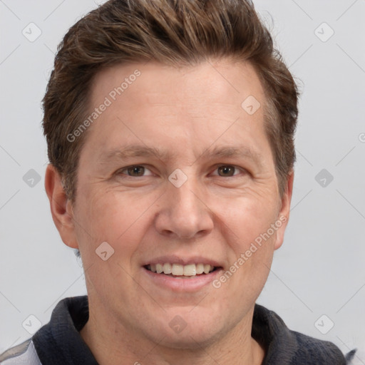 Joyful white adult male with short  brown hair and grey eyes