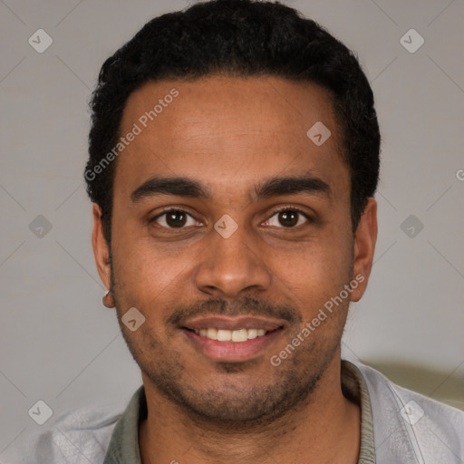 Joyful black young-adult male with short  brown hair and brown eyes