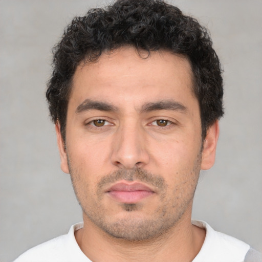 Neutral white young-adult male with short  black hair and brown eyes
