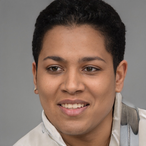 Joyful latino young-adult female with short  brown hair and brown eyes